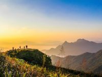 photo of people standing on top of mountain near grasses 733162.jpg